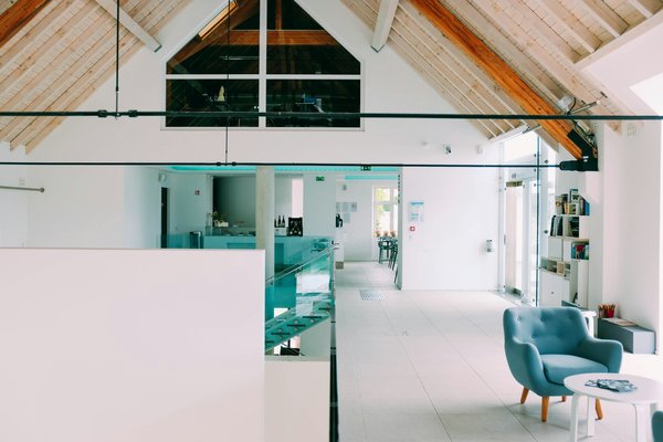 How can you design a cost-effective cooling system for a UK loft conversion?